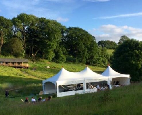 one 20/20ft and one 20/40ft Matrix Marquee Linked on a Devon campsite