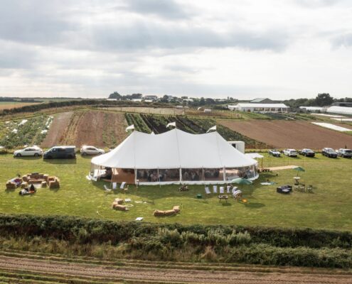 Image of a Trerethern Farm Marquee installation, show casing our 12x24m Sailcloth Marquee