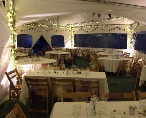 internal image of our Hex Marquees with Fairy lights at night